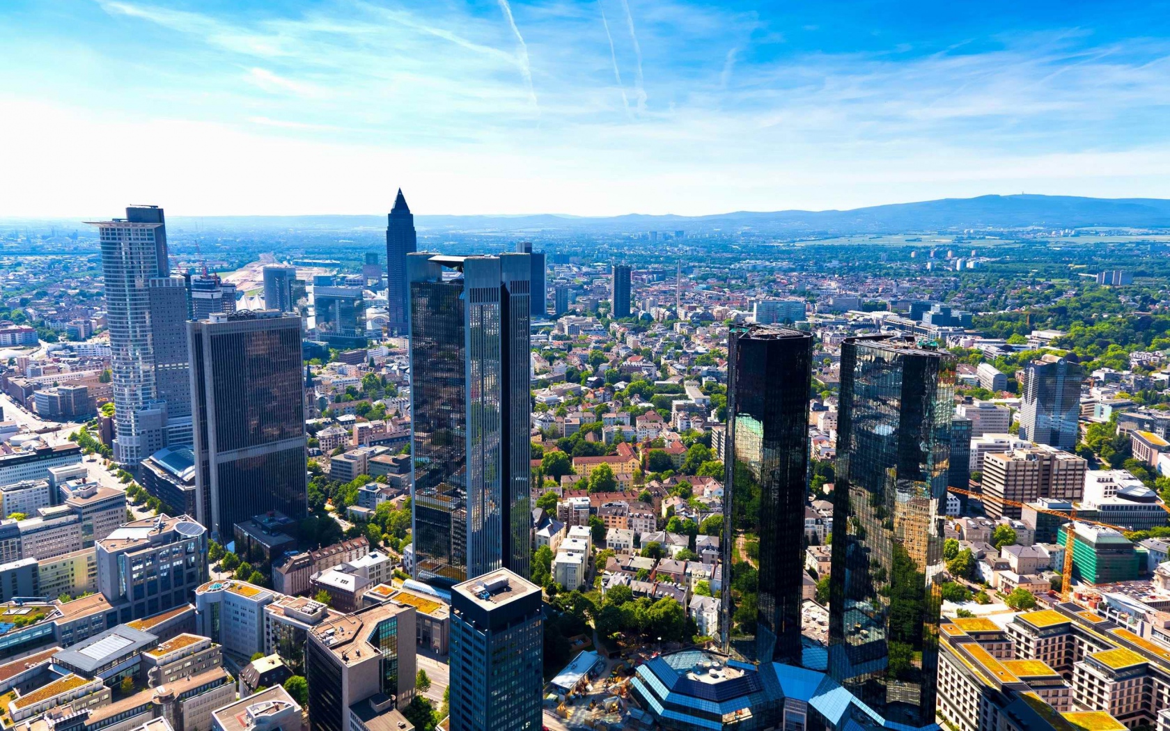 germany_frankfurt_am_main_metropolis_panorama_architecture_tall_buildings_houses_streets_traffic_blue_sky_warm_sunny_day_clouds_horizon_680x1050